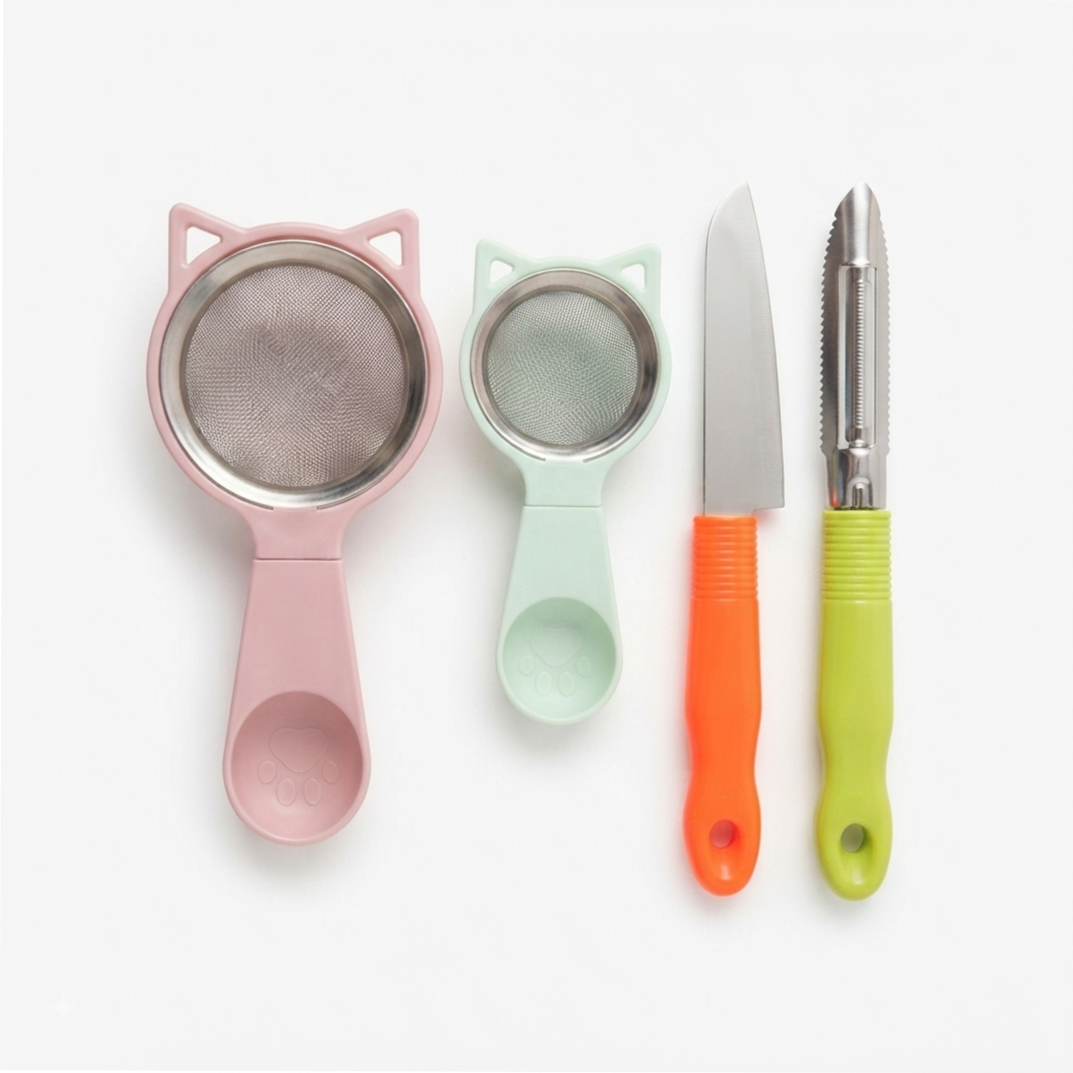 Stainless steel knife, fruit peeler, and tea strainers.